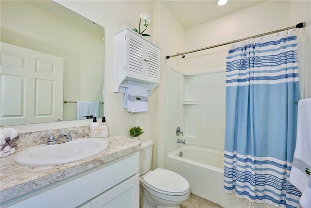 bathroom with toilet, shower / bath combo, and vanity