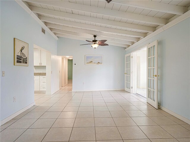 unfurnished room with french doors, wood ceiling, light tile patterned floors, ceiling fan, and lofted ceiling with beams