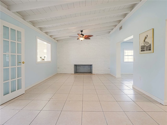 unfurnished living room featuring light tile patterned flooring, ceiling fan, wood ceiling, vaulted ceiling with beams, and a brick fireplace