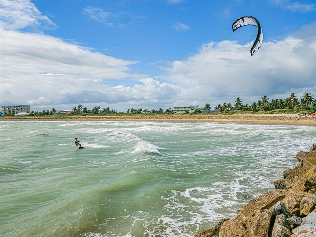 property view of water featuring a beach view