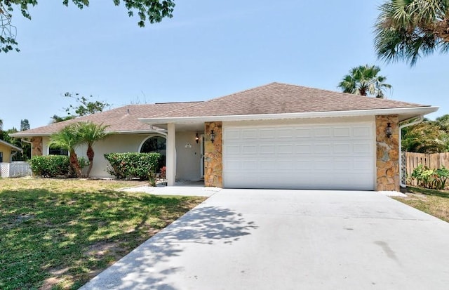 841 Carnation Dr, Sebastian, FL 32958 - ranch-style house featuring driveway, stone siding, an attached garage, and stucco siding