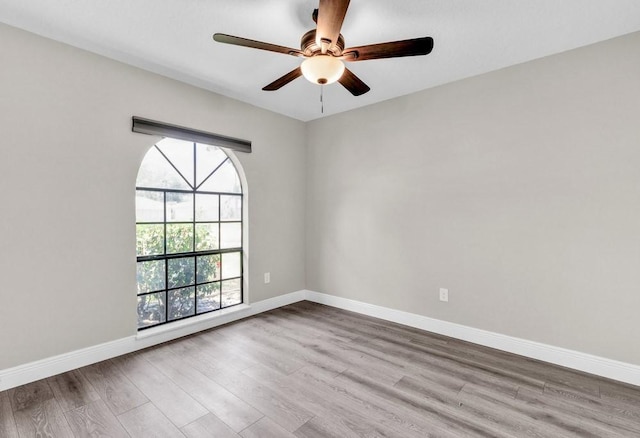 841 Carnation Dr, Sebastian, FL 32958 - unfurnished room featuring wood finished floors, a ceiling fan, and baseboards