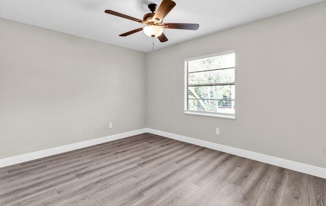 841 Carnation Dr, Sebastian, FL 32958 - empty room with wood finished floors, baseboards, and ceiling fan