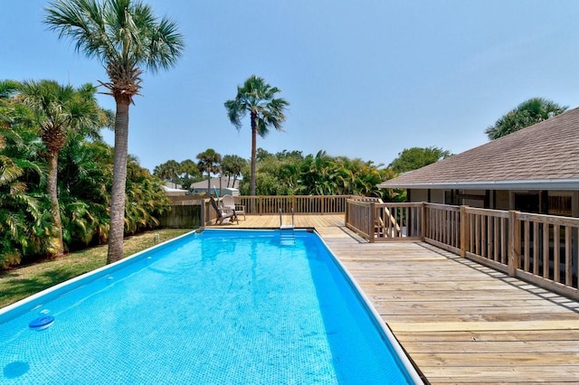 841 Carnation Dr, Sebastian, FL 32958 - view of swimming pool featuring a wooden deck and fence