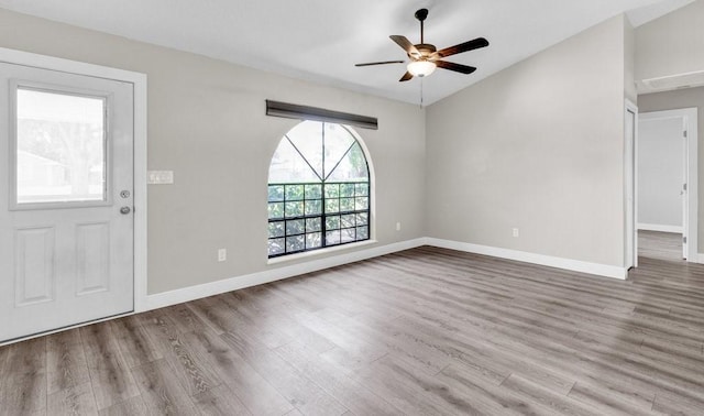 841 Carnation Dr, Sebastian, FL 32958 - entryway with wood finished floors, ceiling fan, baseboards, and vaulted ceiling