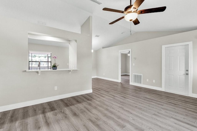 841 Carnation Dr, Sebastian, FL 32958 - spare room featuring ceiling fan, lofted ceiling, wood finished floors, and baseboards