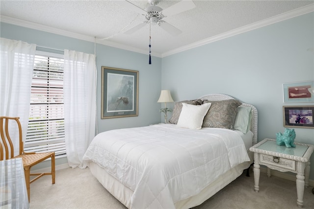 bedroom with ceiling fan, a textured ceiling, ornamental molding, and light carpet