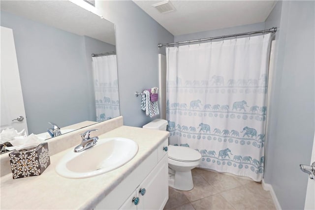 full bathroom featuring tile patterned flooring, toilet, vanity, and curtained shower
