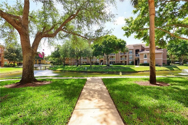 surrounding community featuring a lawn