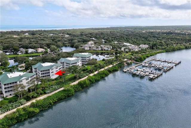 birds eye view of property with a water view