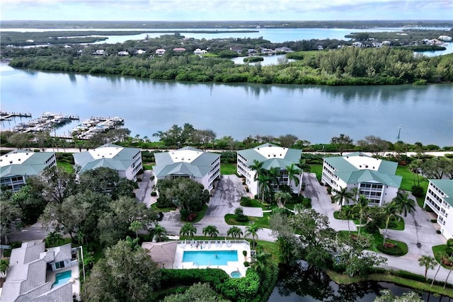 birds eye view of property with a water view