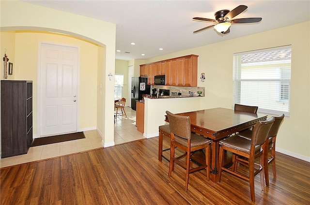 dining space featuring light hardwood / wood-style floors and ceiling fan