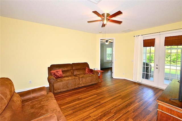 living room with ceiling fan, french doors, and dark wood-type flooring