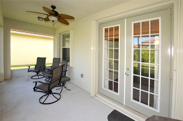 sunroom with ceiling fan and french doors