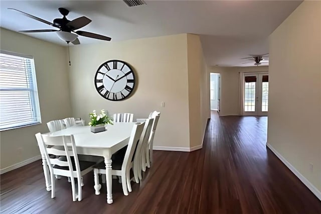 dining space featuring dark hardwood / wood-style floors, a healthy amount of sunlight, ceiling fan, and french doors