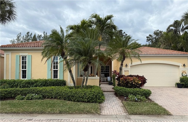 mediterranean / spanish-style home featuring a garage