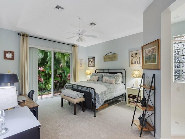 carpeted bedroom featuring access to outside and ceiling fan