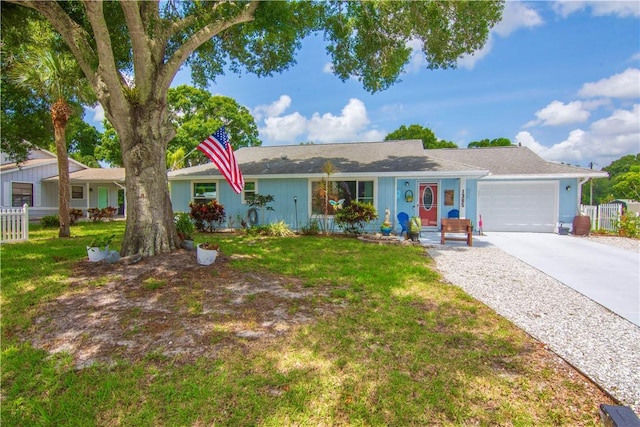 1385 14th Ave, Vero Beach, FL 32960 - ranch-style house with a garage and driveway
