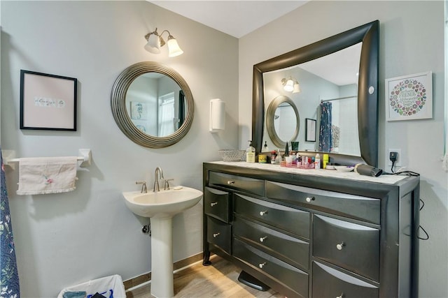 1385 14th Ave, Vero Beach, FL 32960 - bathroom featuring wood finished floors and baseboards