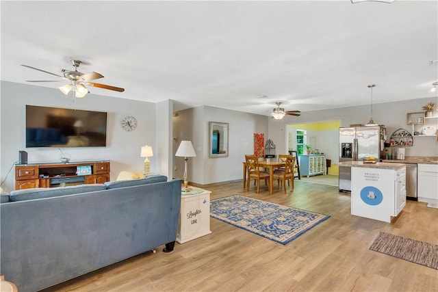 1385 14th Ave, Vero Beach, FL 32960 - living room with ceiling fan and light wood-style floors