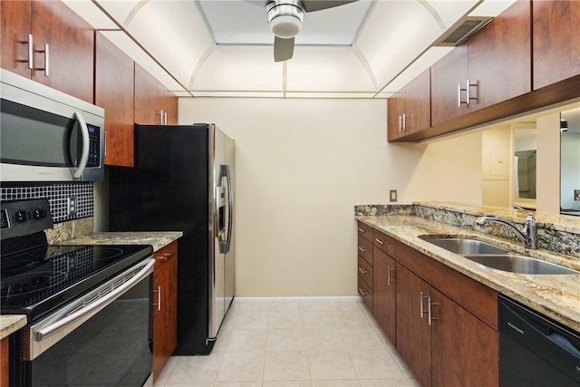 kitchen with visible vents, decorative backsplash, a ceiling fan, a sink, and black appliances