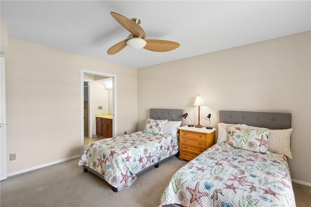 carpeted bedroom featuring baseboards, ceiling fan, and ensuite bath
