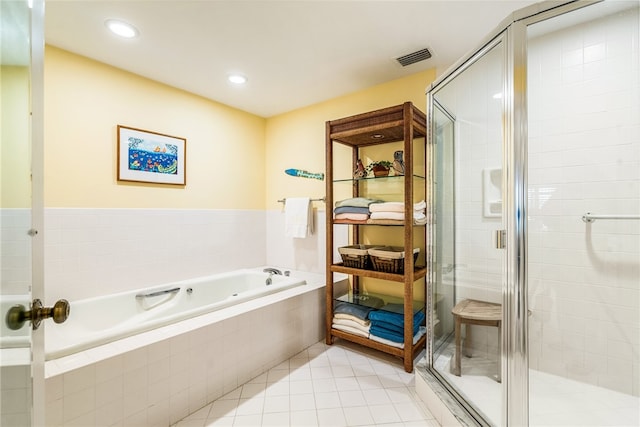 bathroom with tile patterned flooring and plus walk in shower