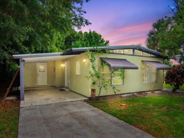 660 14th St, Vero Beach, FL 32960 - mid-century inspired home featuring driveway and an attached carport