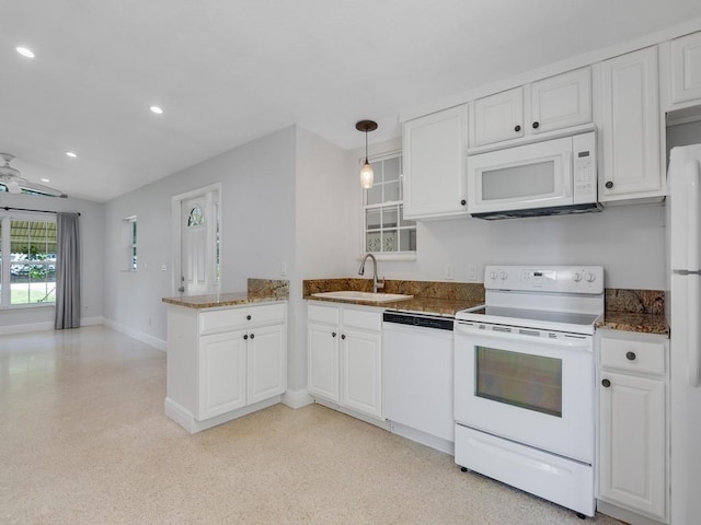 660 14th St, Vero Beach, FL 32960 - kitchen with white appliances, a sink, a peninsula, white cabinetry, and recessed lighting