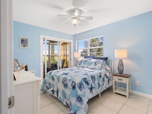 tiled bedroom featuring a textured ceiling, ceiling fan, and access to exterior