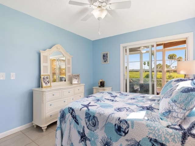 tiled bedroom featuring access to outside, a textured ceiling, and ceiling fan