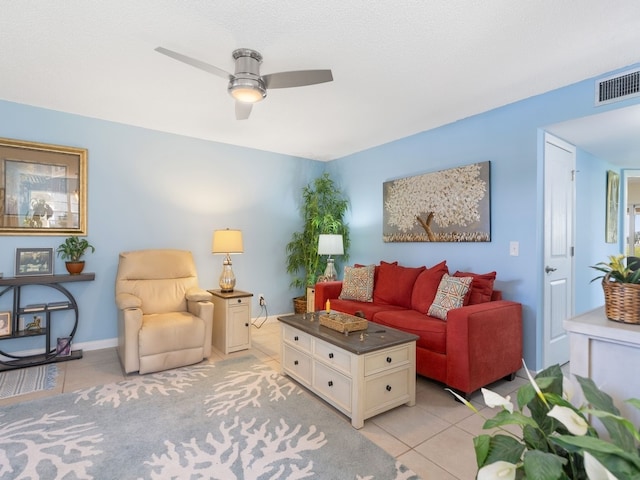 living room featuring ceiling fan and light tile patterned floors