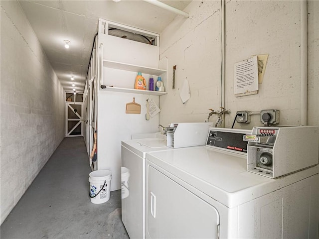 2800 Indian River Blvd Unit L2, Vero Beach, FL 32960 - community laundry featuring separate washer and dryer and concrete block wall