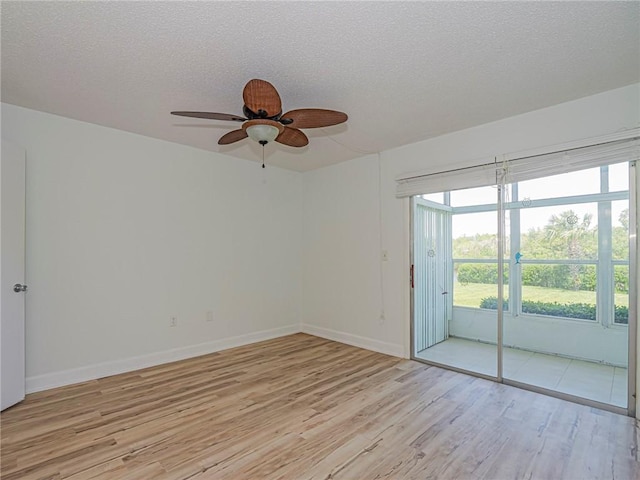 2800 Indian River Blvd Unit L2, Vero Beach, FL 32960 - empty room with light wood-style floors, a textured ceiling, ceiling fan, and baseboards
