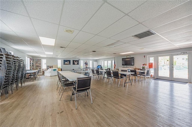 2800 Indian River Blvd Unit L2, Vero Beach, FL 32960 - dining room featuring wood finished floors, a drop ceiling, and french doors