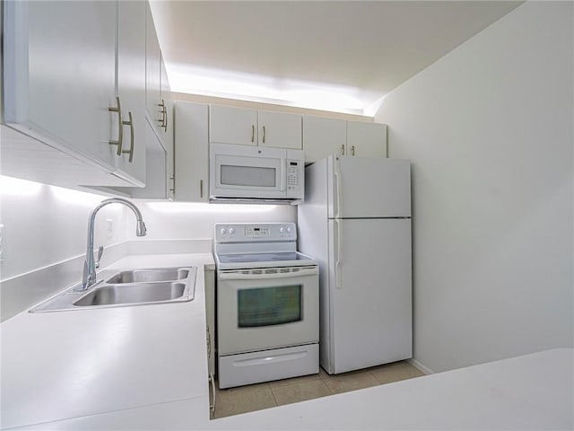 2800 Indian River Blvd Unit L2, Vero Beach, FL 32960 - kitchen with white appliances, a sink, light tile patterned flooring, and light countertops