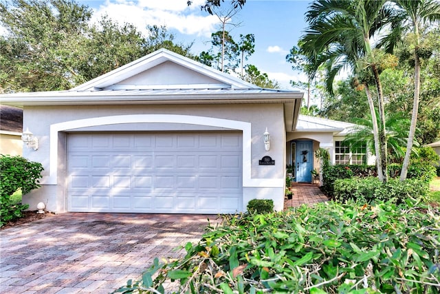 single story home with a garage