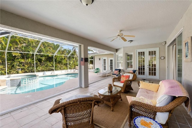 view of pool with glass enclosure, french doors, a patio area, and a pool with connected hot tub