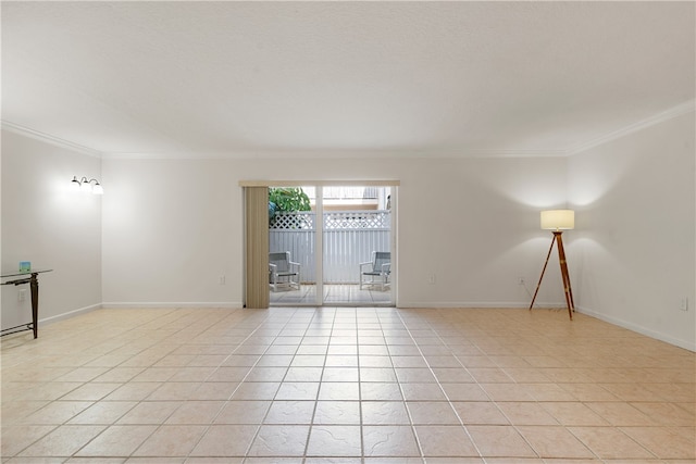 spare room featuring light tile patterned flooring and crown molding