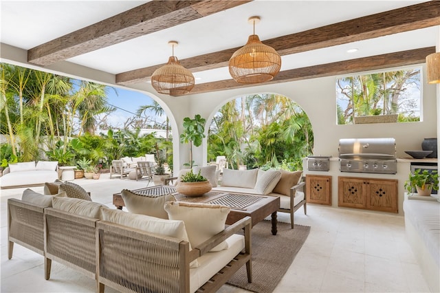 view of patio / terrace with an outdoor kitchen, a grill, and an outdoor living space