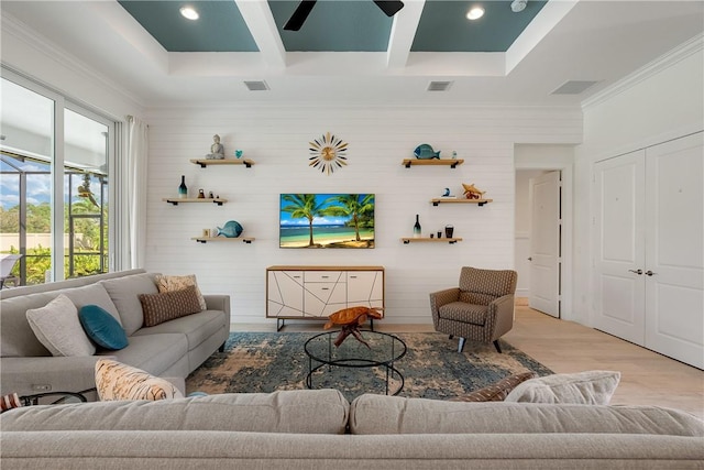 living room featuring crown molding, wood finished floors, coffered ceiling, wooden walls, and ceiling fan