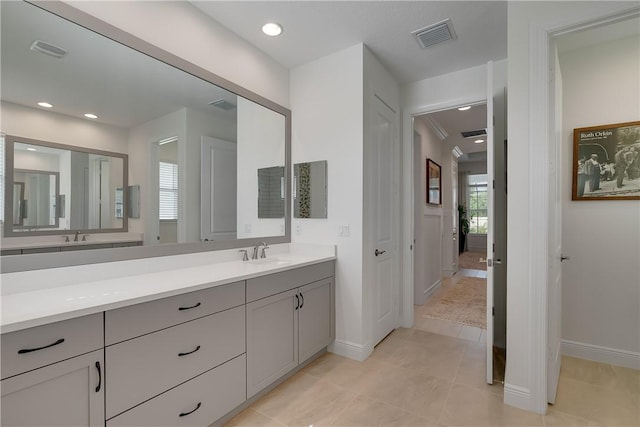 full bathroom featuring baseboards, vanity, tile patterned flooring, and recessed lighting