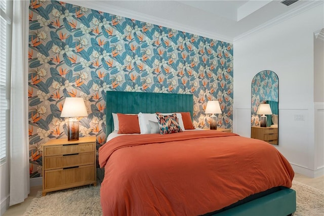 bedroom featuring wallpapered walls and crown molding