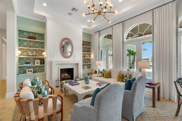 815 Starboard Dr, Vero Beach, FL 32963 - sitting room with crown molding, a tray ceiling, built in features, and french doors