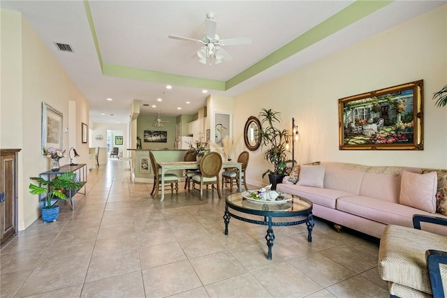 living area with visible vents, recessed lighting, light tile patterned flooring, baseboards, and ceiling fan