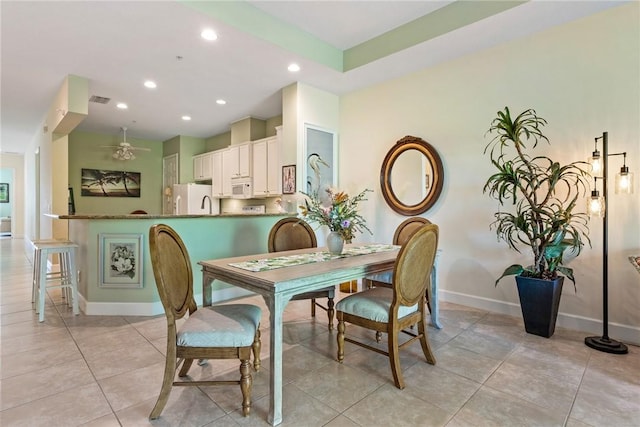 dining space featuring light tile patterned flooring, recessed lighting, baseboards, and ceiling fan