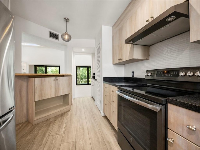 kitchen featuring hanging light fixtures, backsplash, stainless steel appliances, exhaust hood, and light wood-type flooring