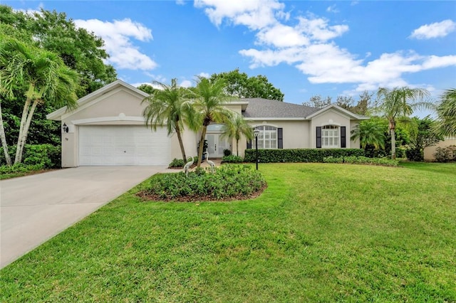 ranch-style home with driveway, a front yard, a garage, and stucco siding