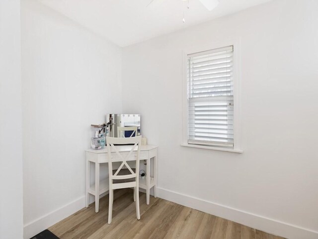 office with ceiling fan and light wood-type flooring