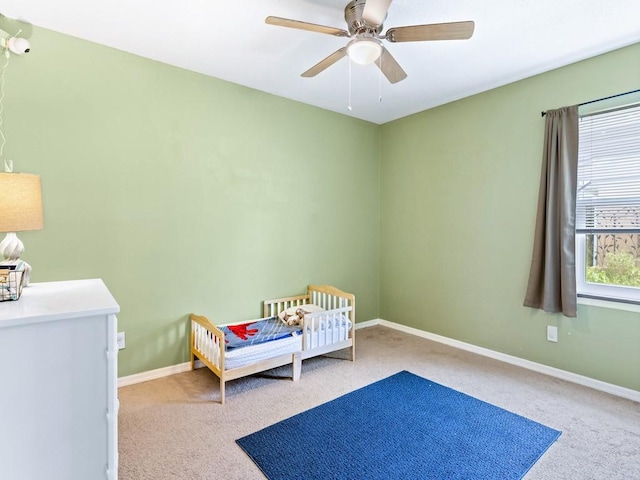 bedroom with light carpet and ceiling fan